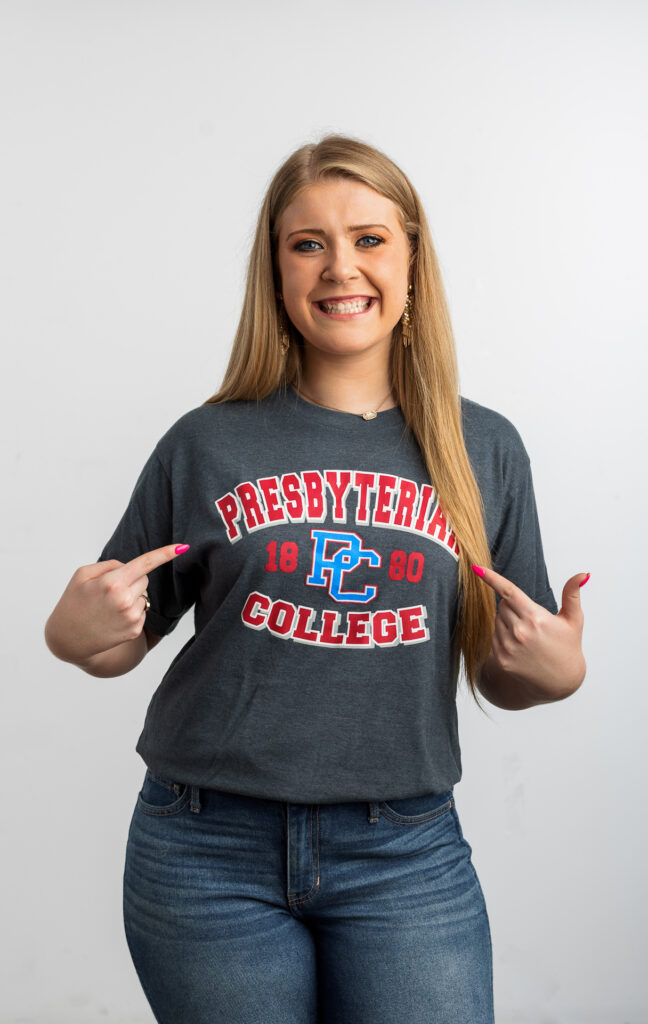 Presbyterian College student posing with a PC t-shirt.