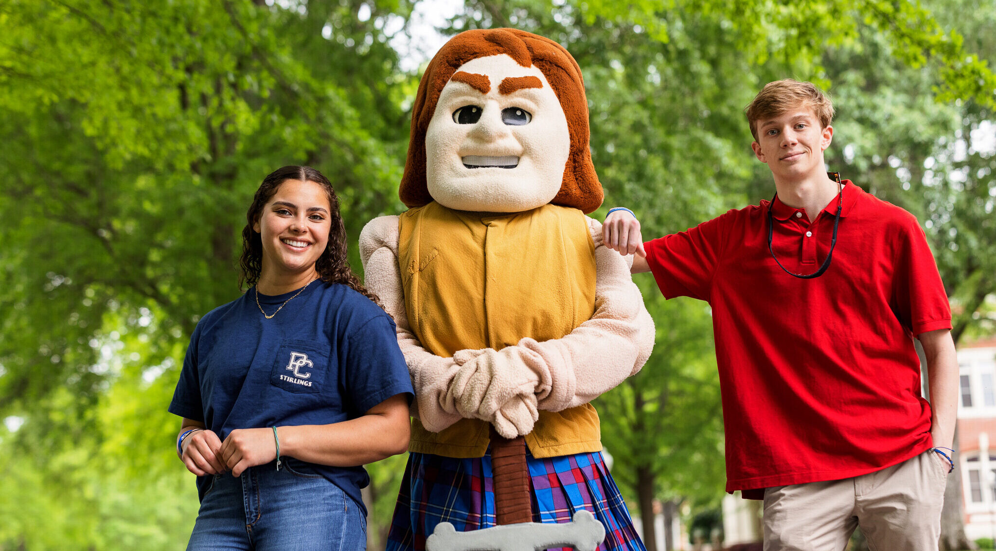 Presbyterian College students posing with our mascot, Scotty the Scotsman.
