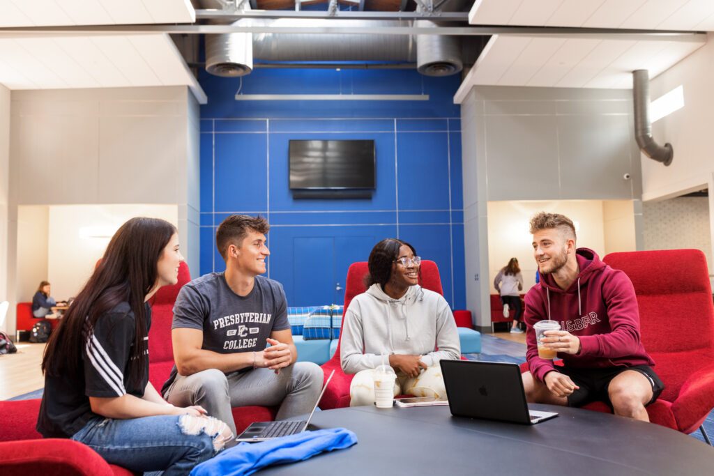 PC students hanging out in Springs Great Room. 