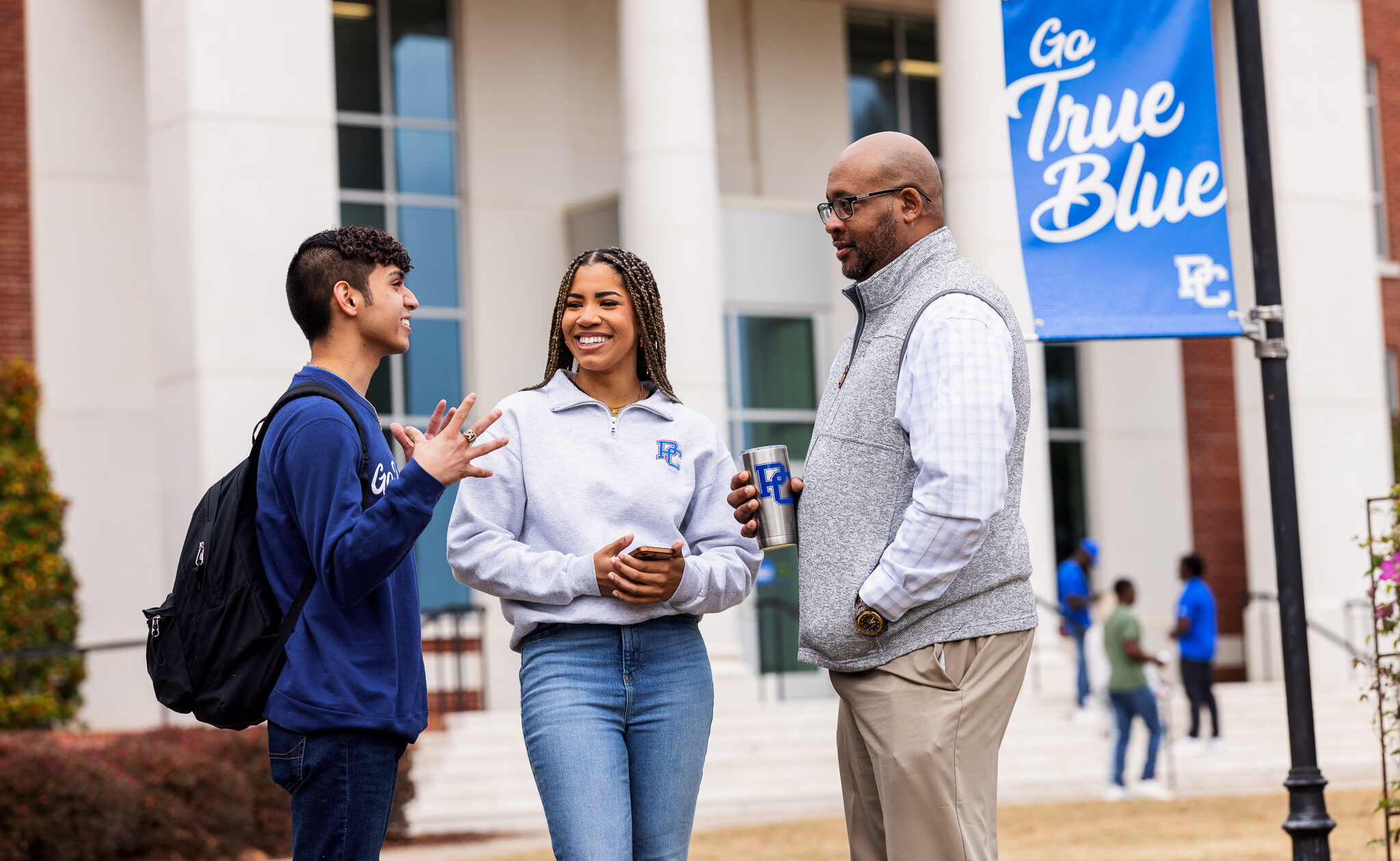 Dr. Will Harris with two students.