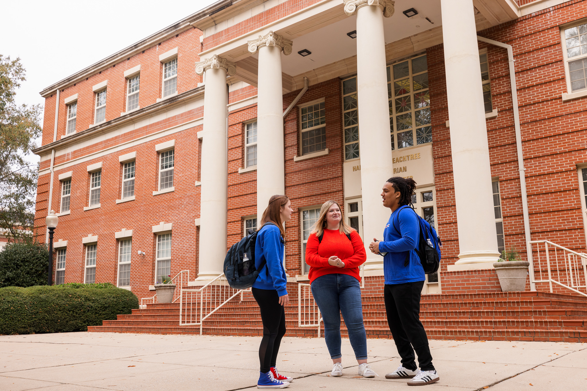 Students gathered outside of the Harrington Peachtree building on campus.