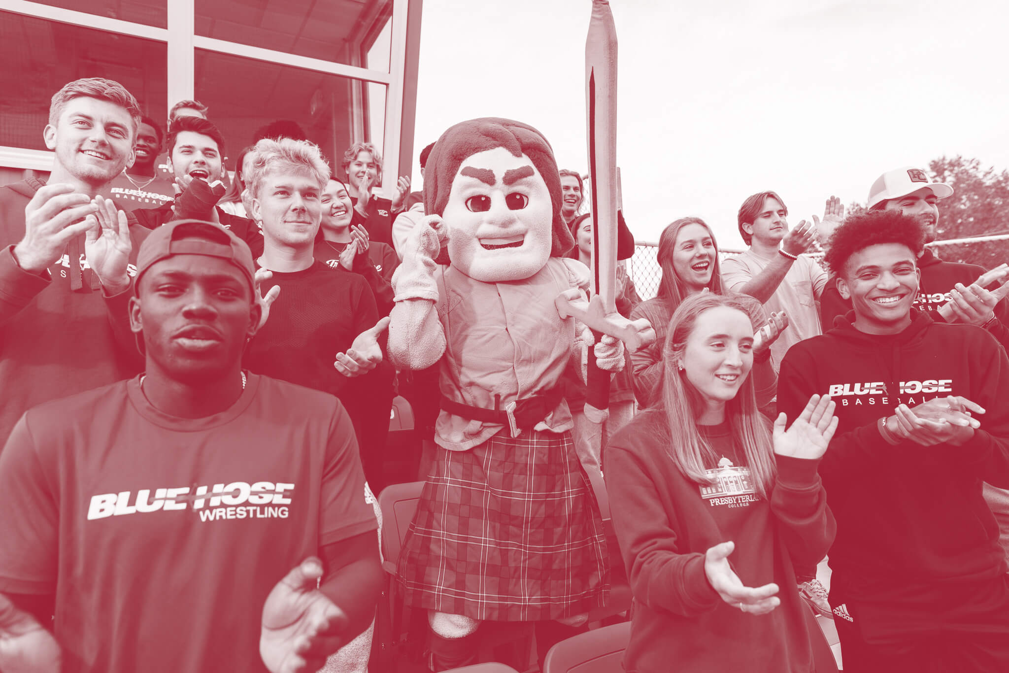 Presbyterian College students cheering with Scotty the Scotsman, our mascot.