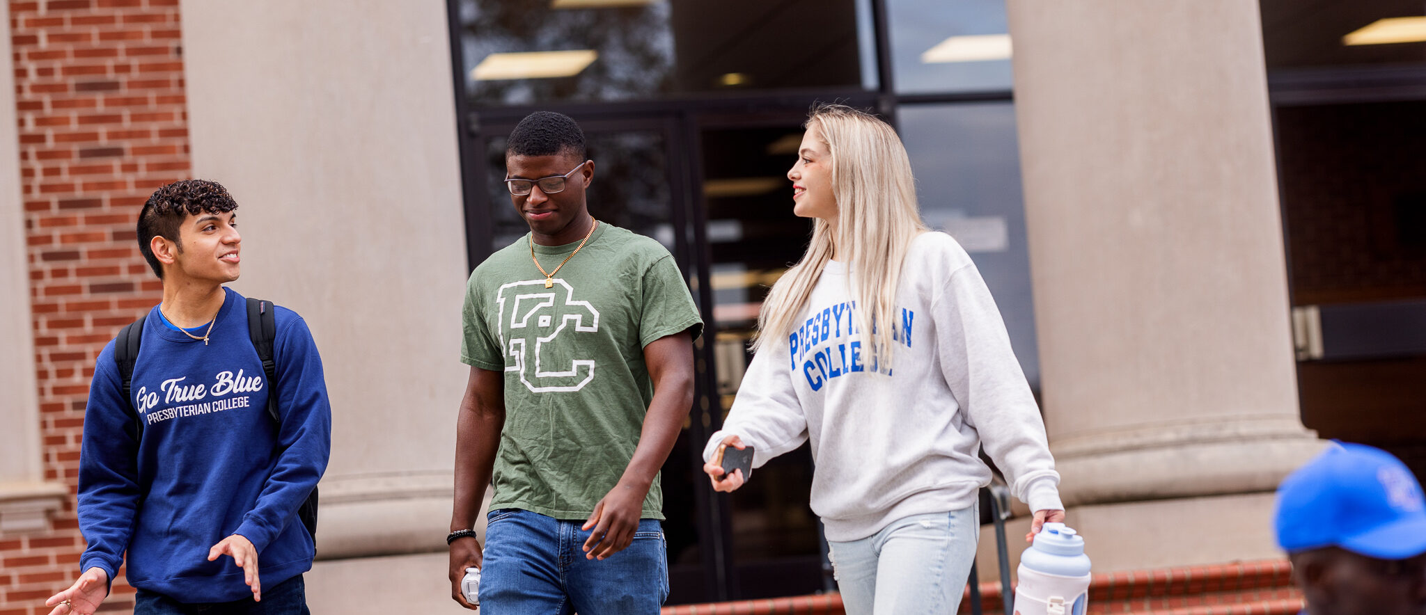 Students walking outside of the library.