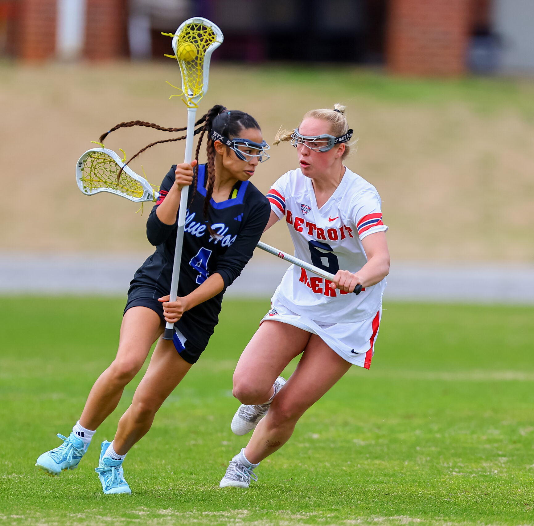 Presbyterian College Women's Lacrosse player in a game.