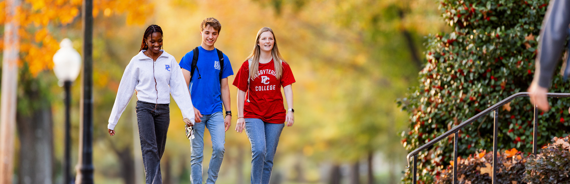 Presbyterian College students walking through campus in the fall.