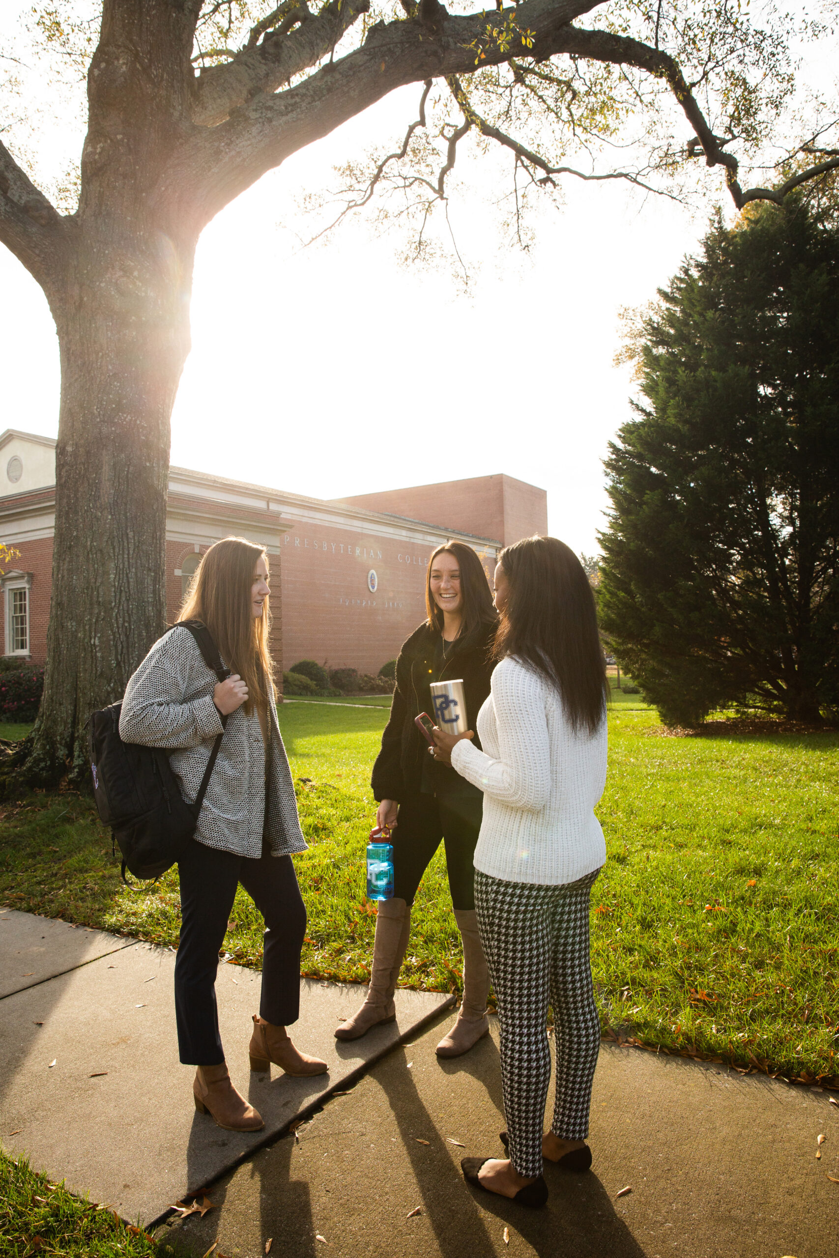 Presbyterian College students talking outside of Belk Auditorium.