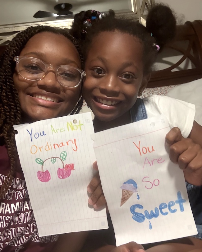 A Presbyterian College student unites with a young child to write encouraging notes during the Fall Service Day on Sept. 6.