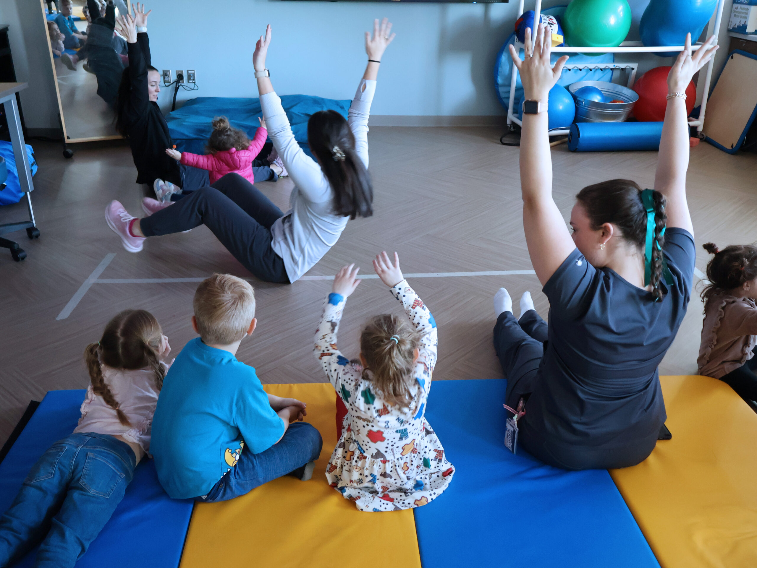 Presbyterian College Occupational Therapy Doctoral students with kids during a Sensory Night activity.