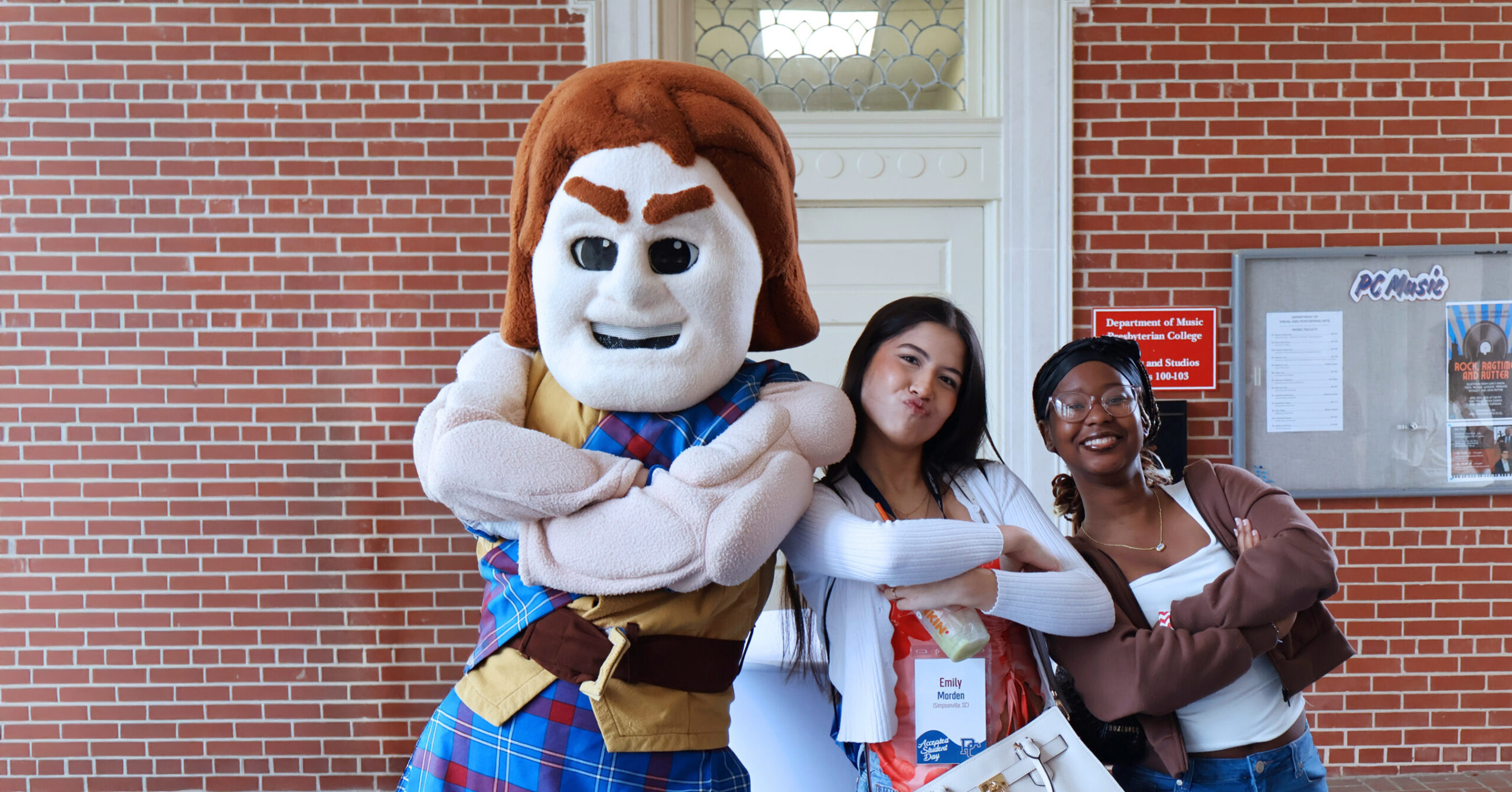 Presbyterian College accepted students posing with our mascot, Scotty the Scotsman.