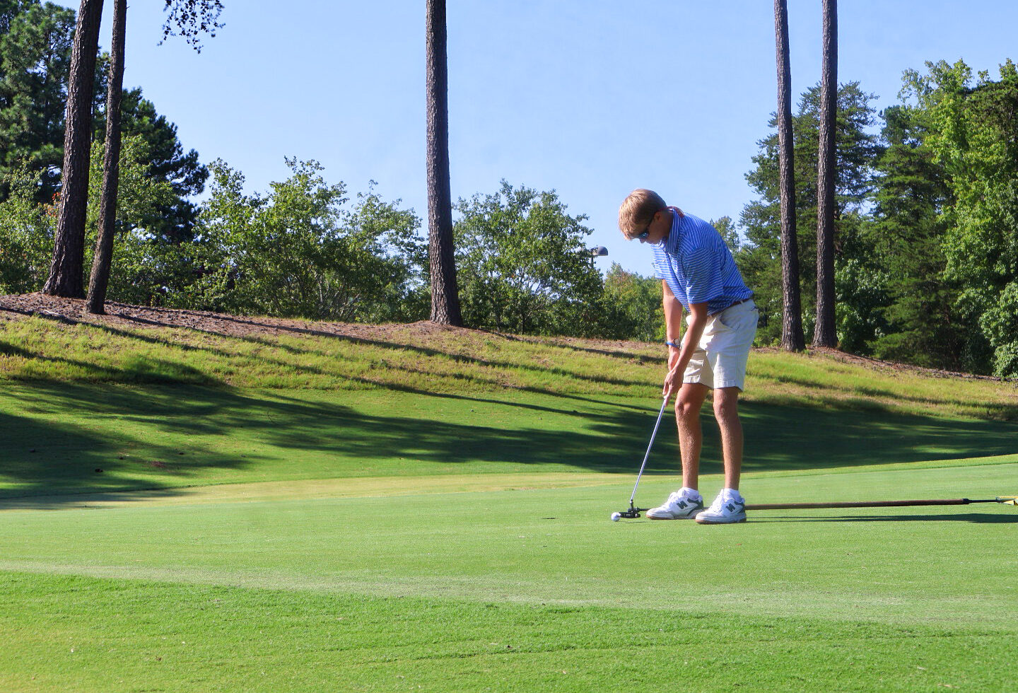 PC student playing in the Welcome Week golf tournament.