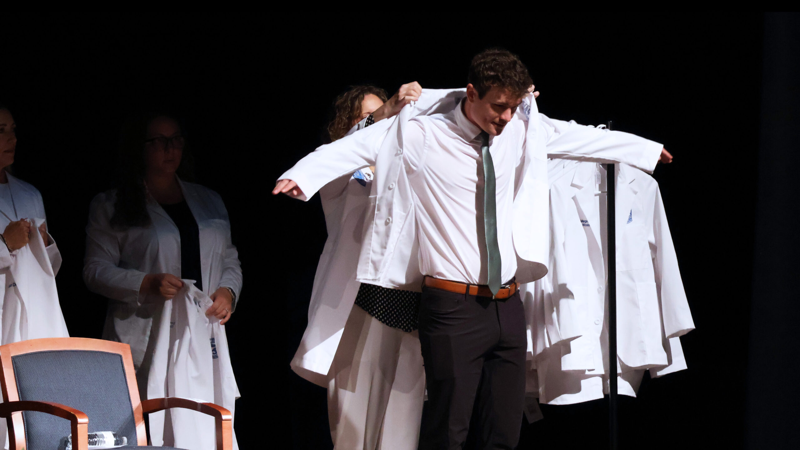 Presbyterian College Physician Assistant student receiving his white coat.