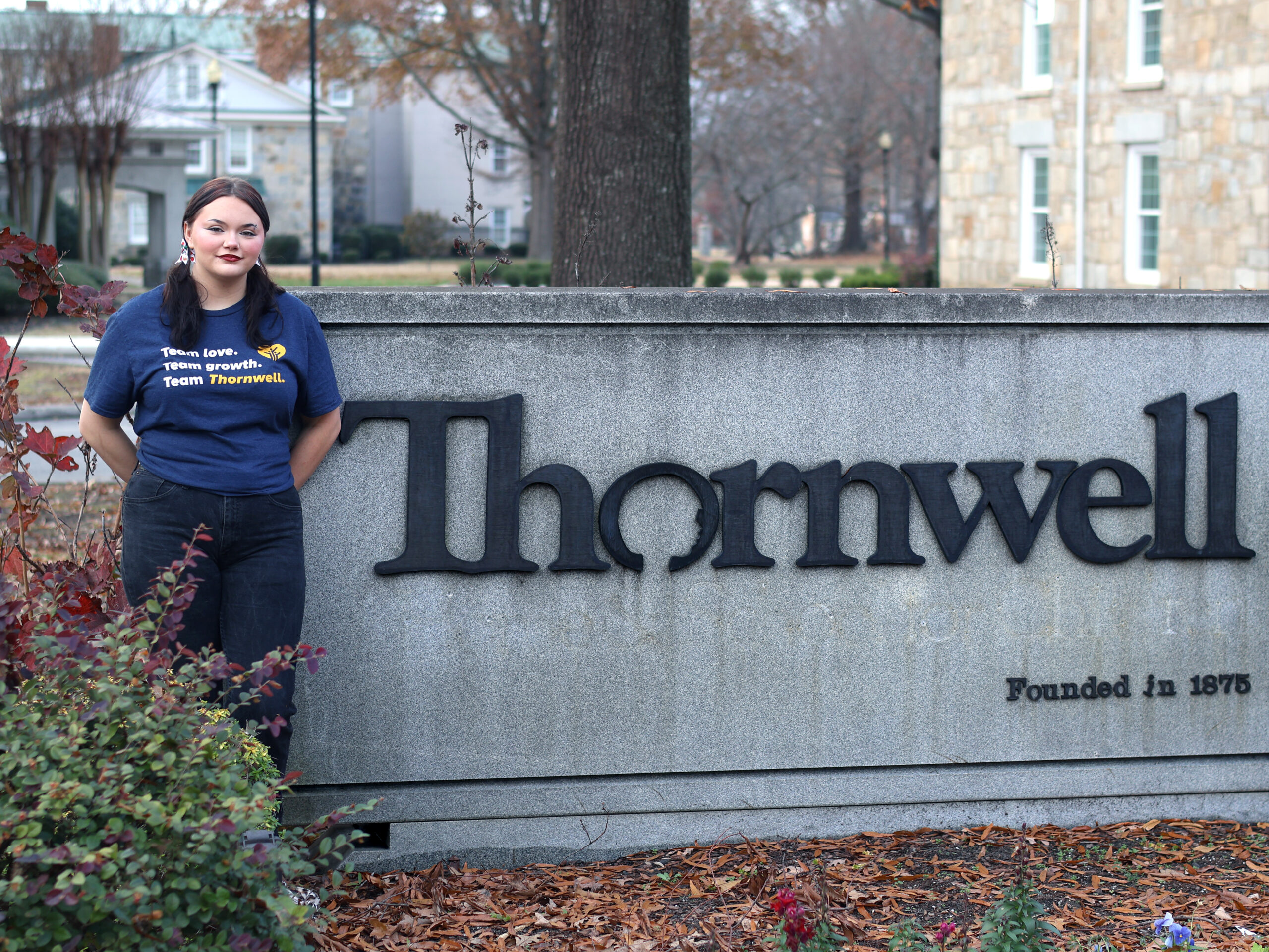 Presbyterian College student standing in front of Thornwell Children's Home