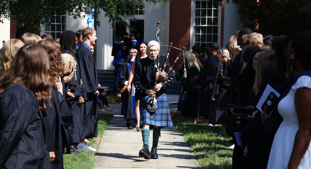 Pipe master Gary Hipp leads the processional into Presbyterian College's 146th opening convocation ceremony.