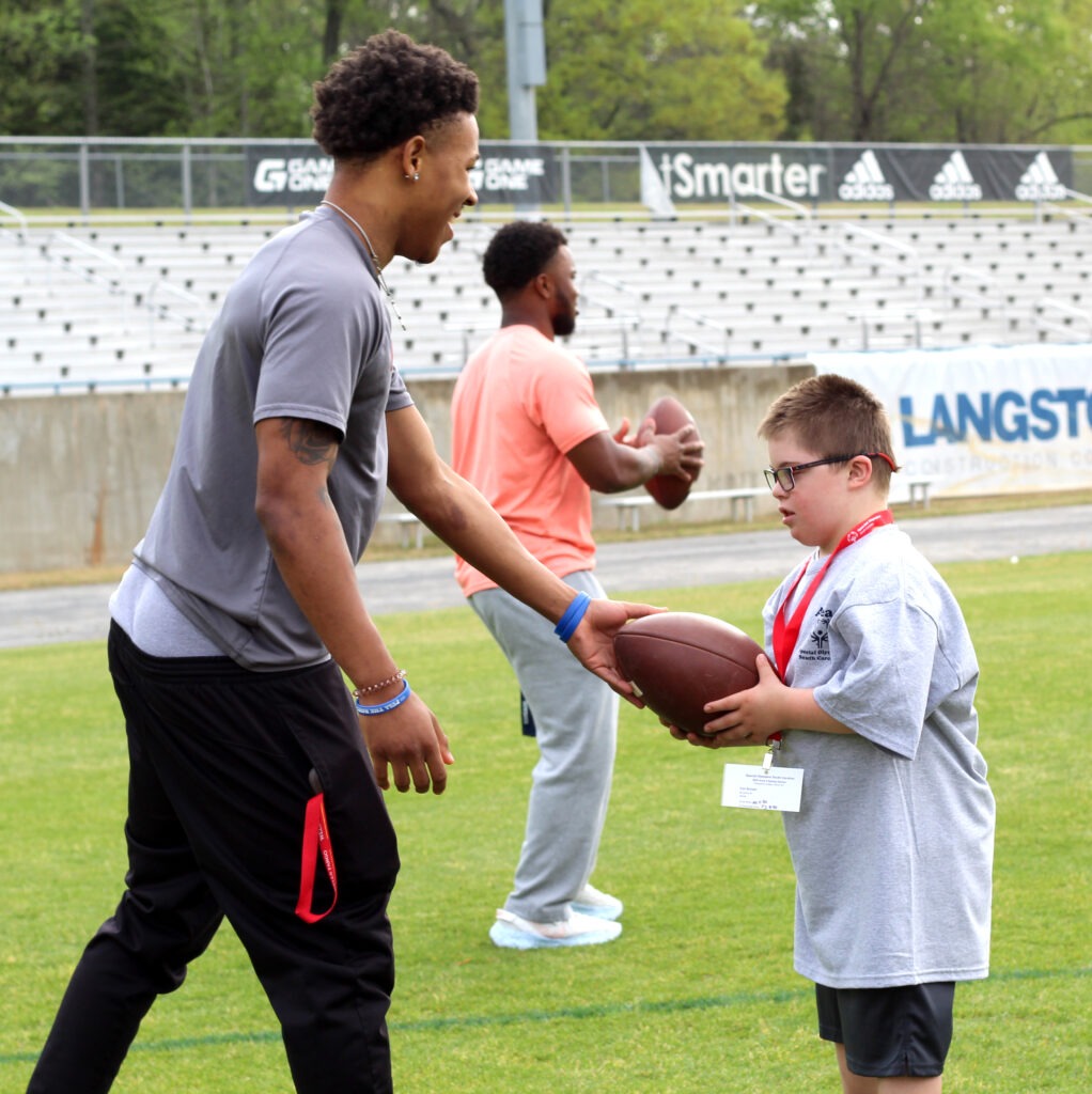 PC student playing with a Special Olympics athlete. 