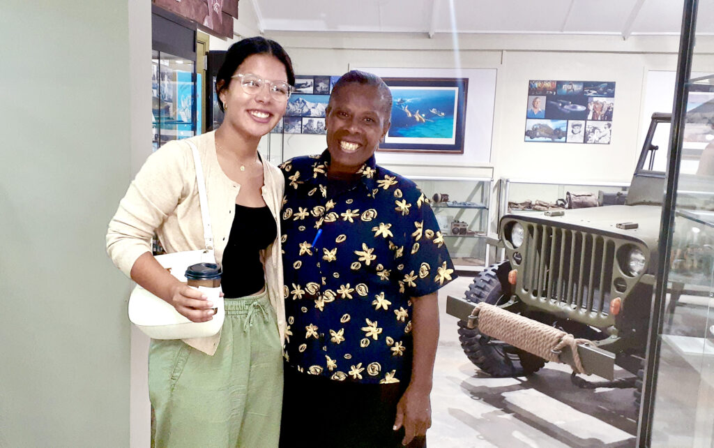 A Presbyterian College student and the support officer at the South Pacific World War II Museum pose for a picture