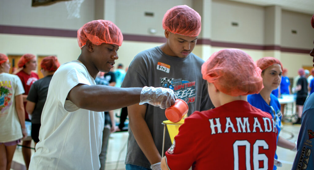 First year students at Presbyterian College join forces at First Presbyterian Church in Clinton to volunteer for Rise Against Hunger.
