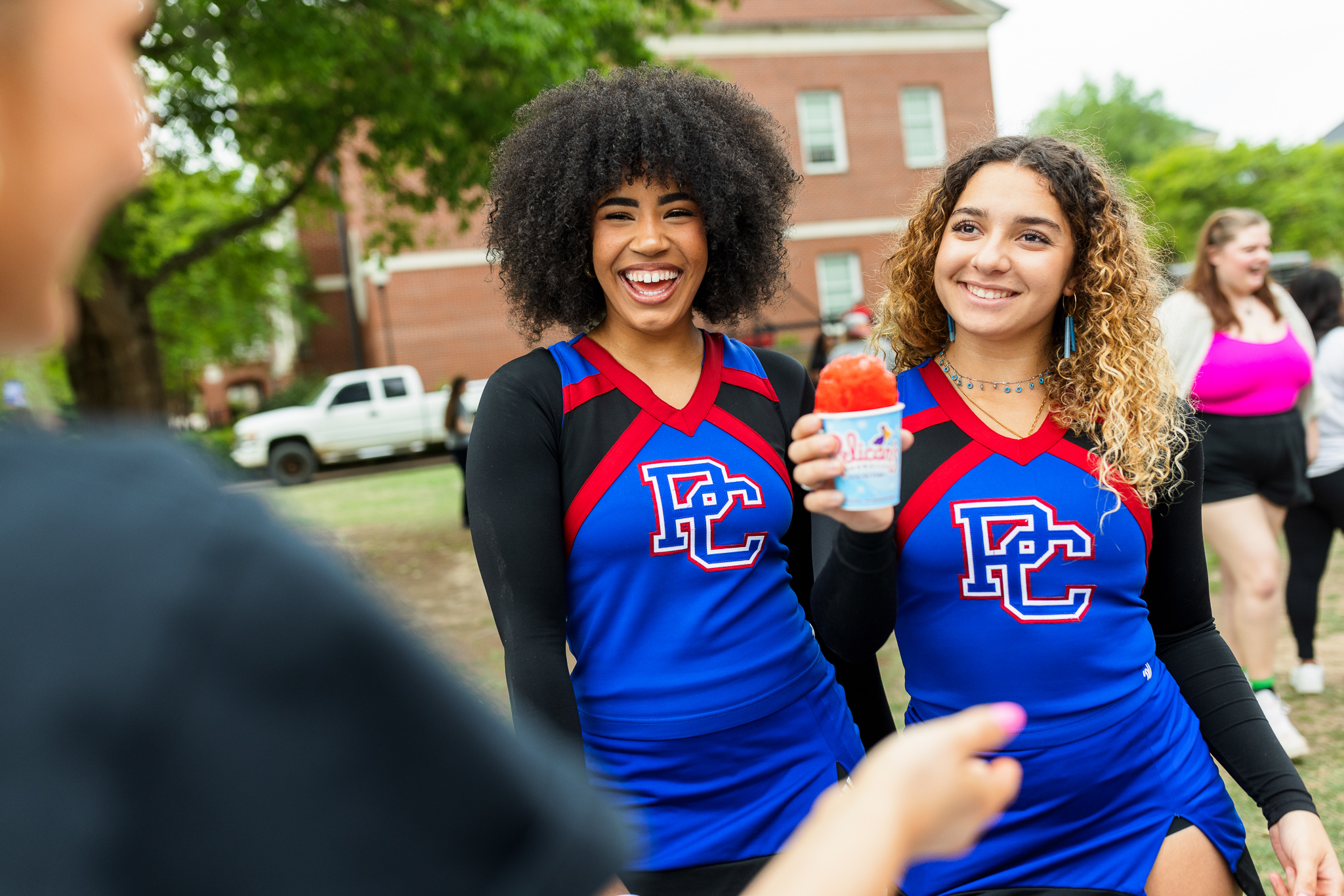 Presbyterian College students, Isis Trapp and Habana Rubio, posing with a snow cone.