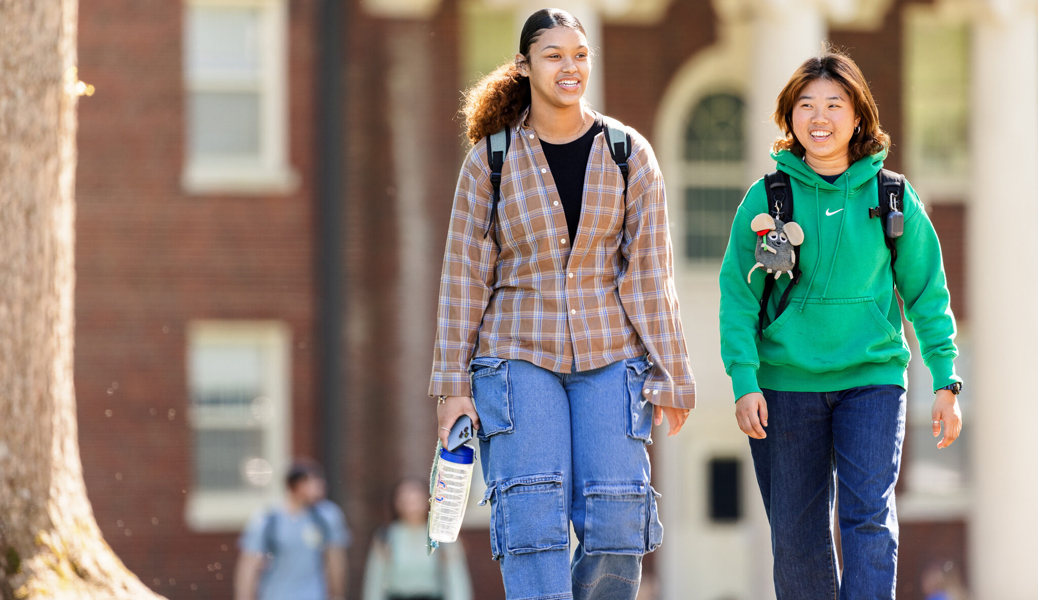 Two Presbyterian College students walking through campus.