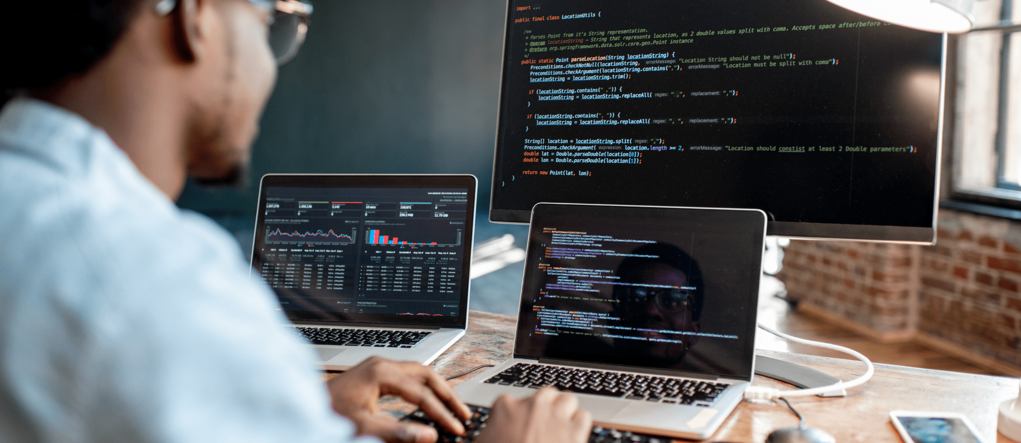 Student coding on a computer. 