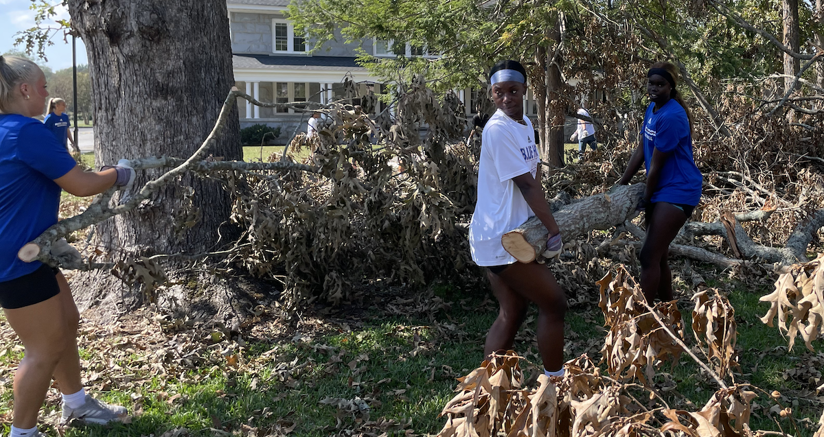 Members of Presbyterian College's women's basketball team volunteered to clear brush and limbs from the Thornwell campus in Clinton following Hurricane Helene.