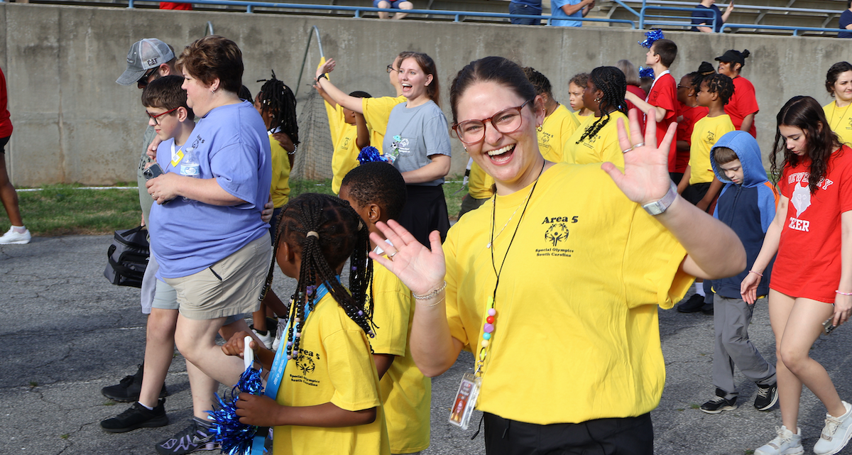 Special Olympians and their many supporters take a lap around the track at Presbyterian College's Bailey Memorial Stadium during the Area 5 Special Olympics on April 4.