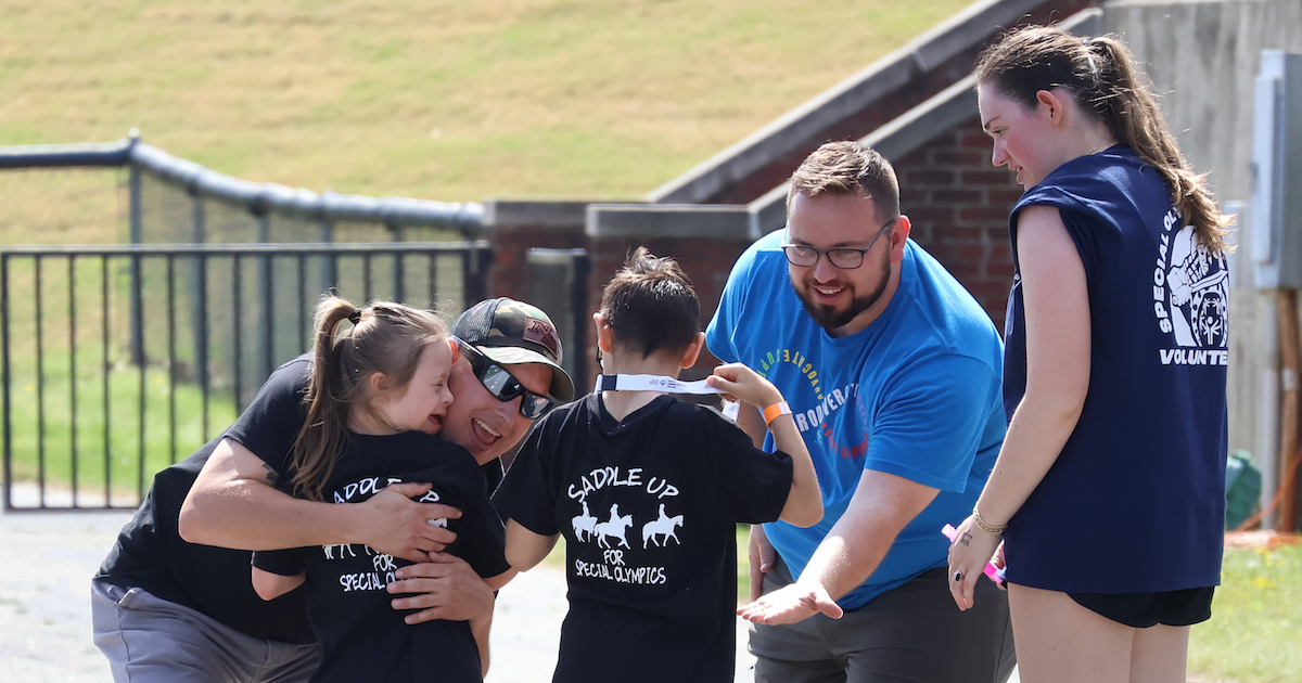 Area 5 Special Olympians are greeted at the finish line by volunteers at the event sponsored by Presbyterian College Student Volunteer Services.