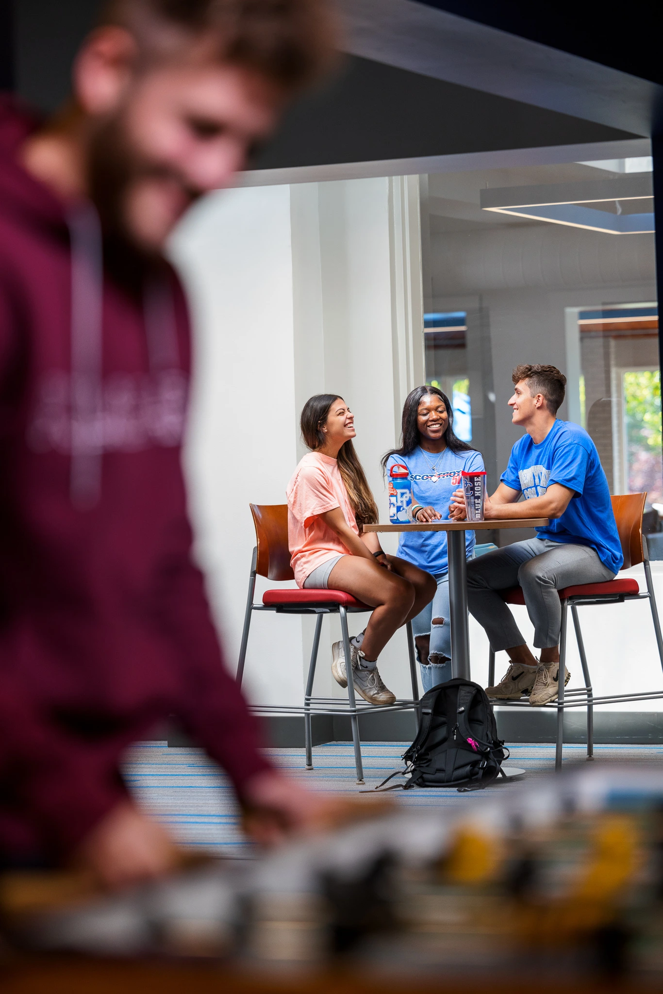 Presbyterian College students laughing in Springs Student Center.